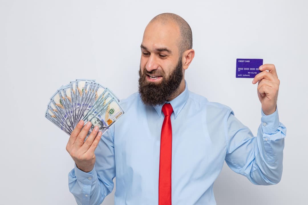 bearded man holding money
